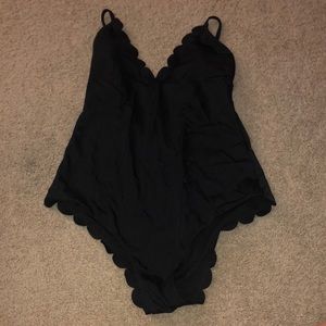 Black one piece bathing suit with eyelet wave trim